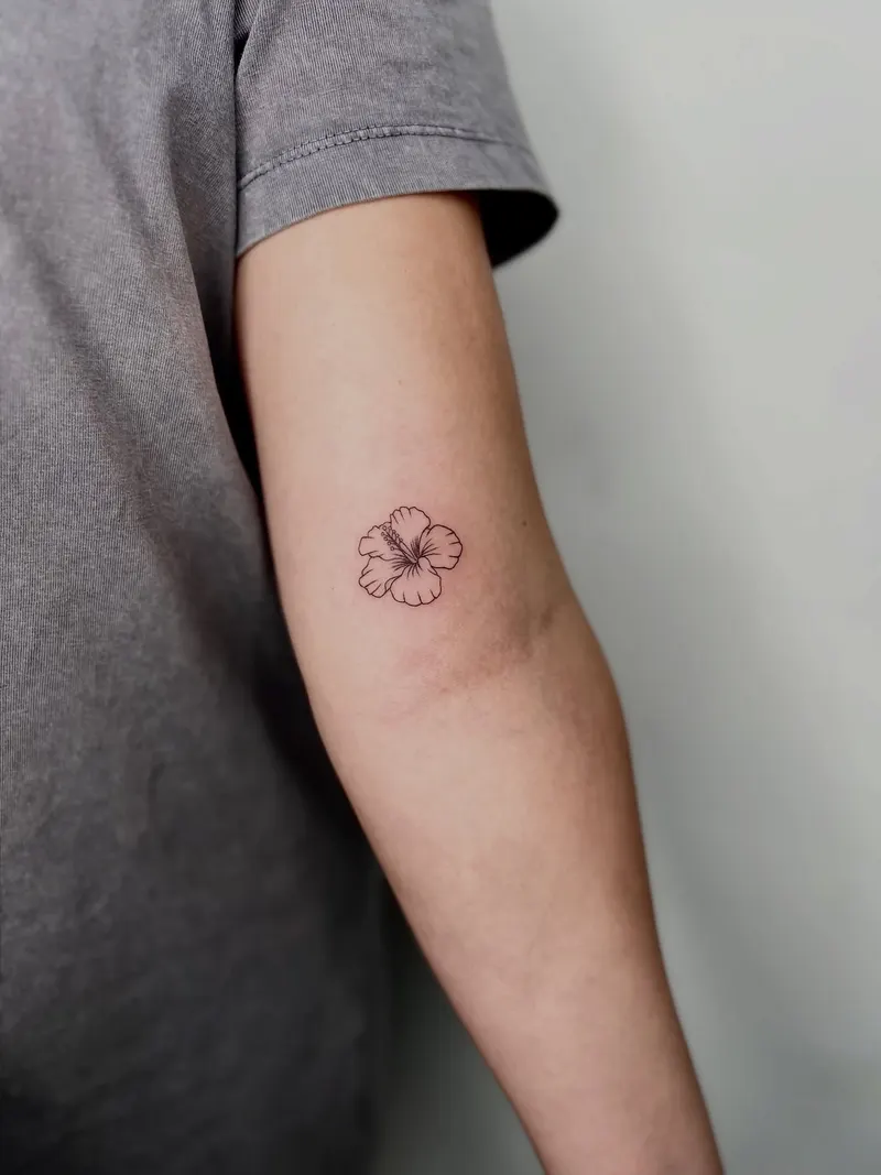 Fine line hibiscus on an arm